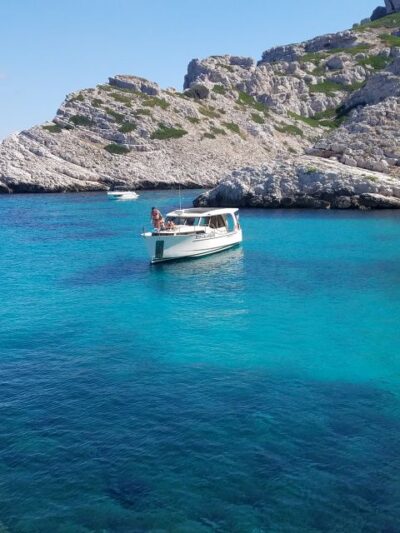 From Marseille: Calanques National Park Eco Boat Cruise - First Calanques swim cove: snorkeling gear and a real break