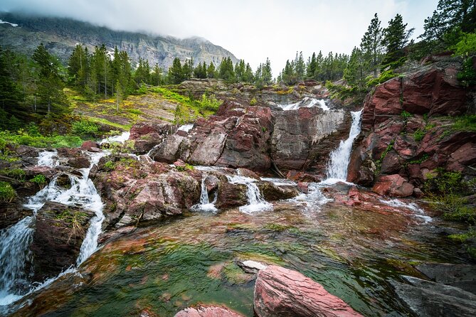 Glacier National Park Going-to-the-Sun Road Self-Guided Tour - Lake McDonald highlights: first views, rainbow rocks, and a lodge built in 1914