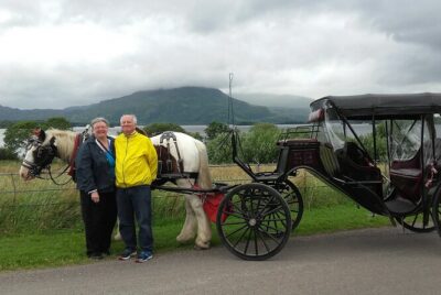 Killarney National Park Tour - Boarding the private carriage: rain cover, blankets, and a slower rhythm