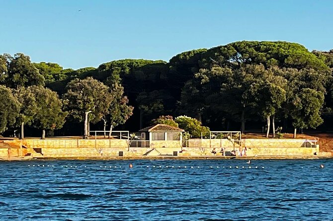 NP Brijuni Island Swimming & Dolphin Watching Sunset Cruise - The Sunset Highlight: Sea Views and the Return Past Uljanik Cranes