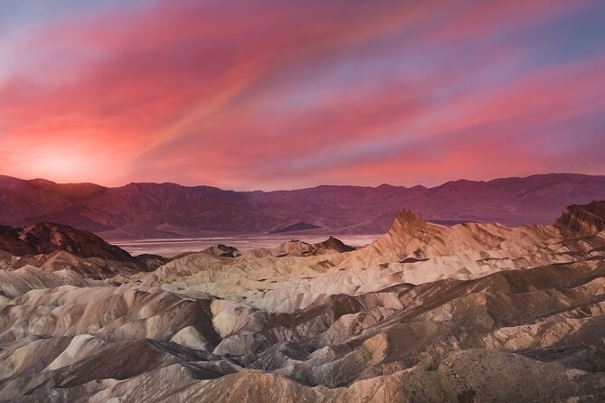 Small Group One Day Tour Death Valley National Park and Rhyolite Ghost Town - Zabriskie Point: Badlands Below, Salt Flats Farther Out